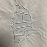 Embroidered table placemat with initials AW