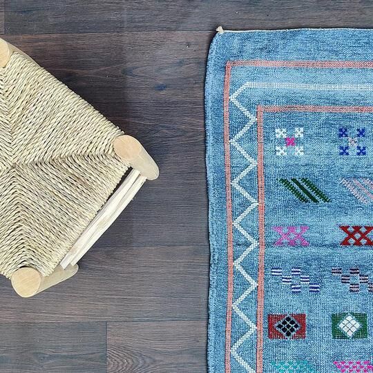 Faded blue Berber ethnic carpet