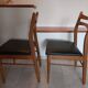 5 Scandinavian style chairs, wood and black faux leather.