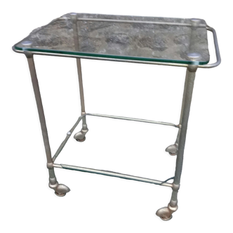 Small rolling table in glass and gold metal