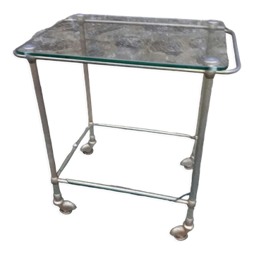 Small rolling table in glass and gold metal