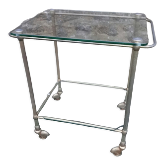 Small rolling table in glass and gilded metal