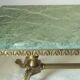 Green marble coffee table with vintage brass.