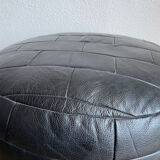 Black patchwork leather pouf from Sède