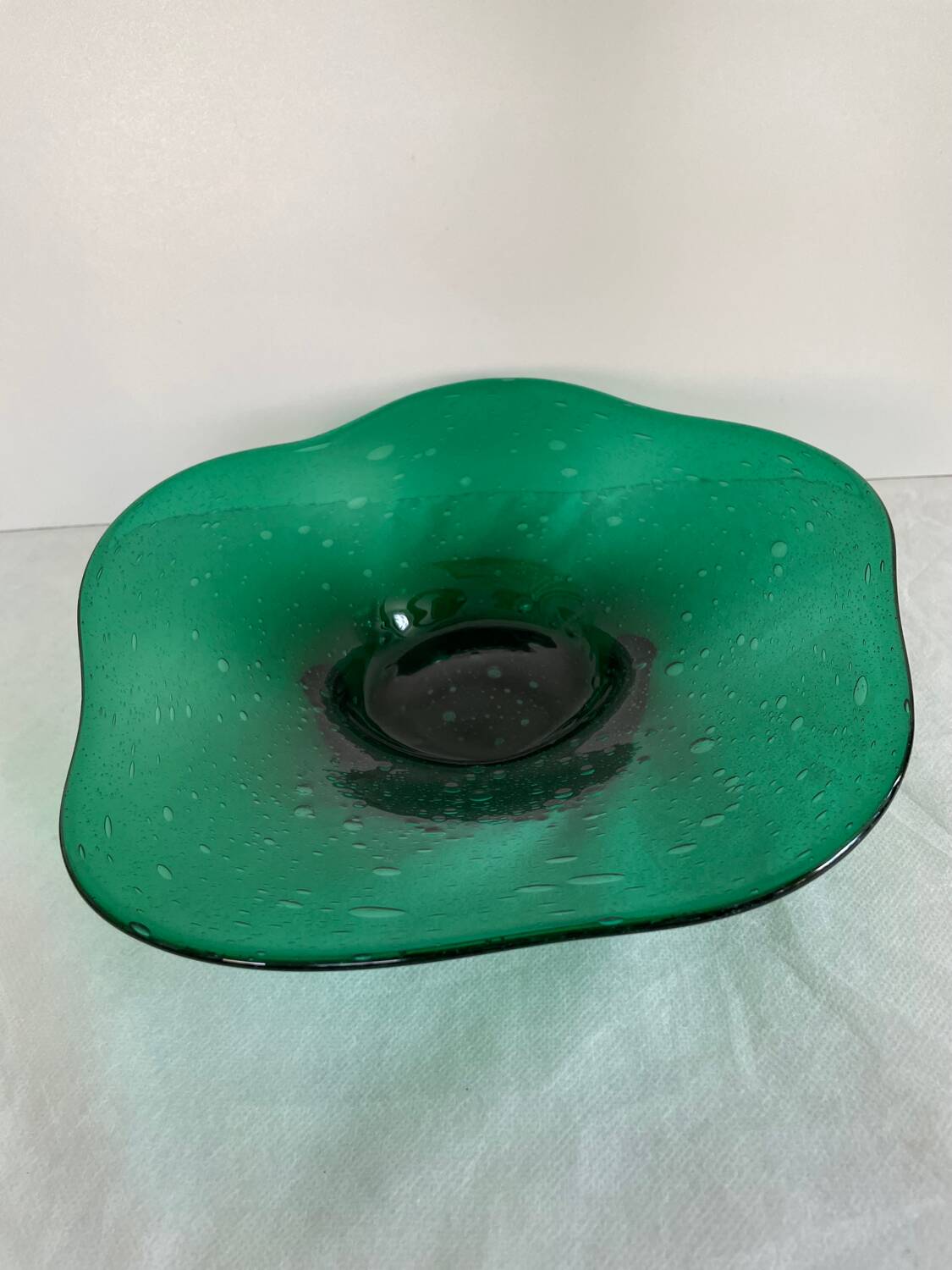 Green glass dish by Max Verboeket