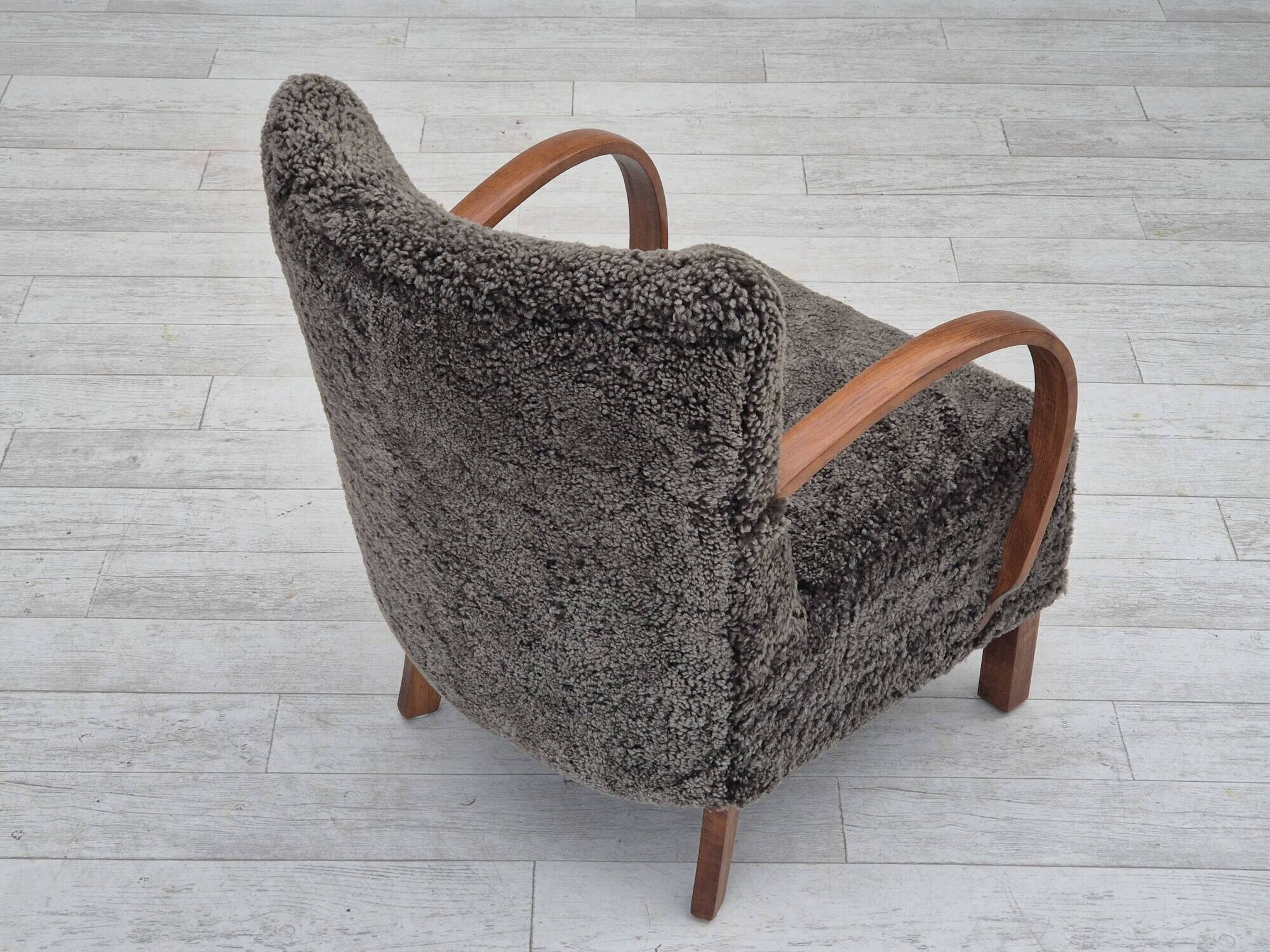 1960s, completely reupholstered Danish art deco armchair, genuine sheepskin "Wellington".