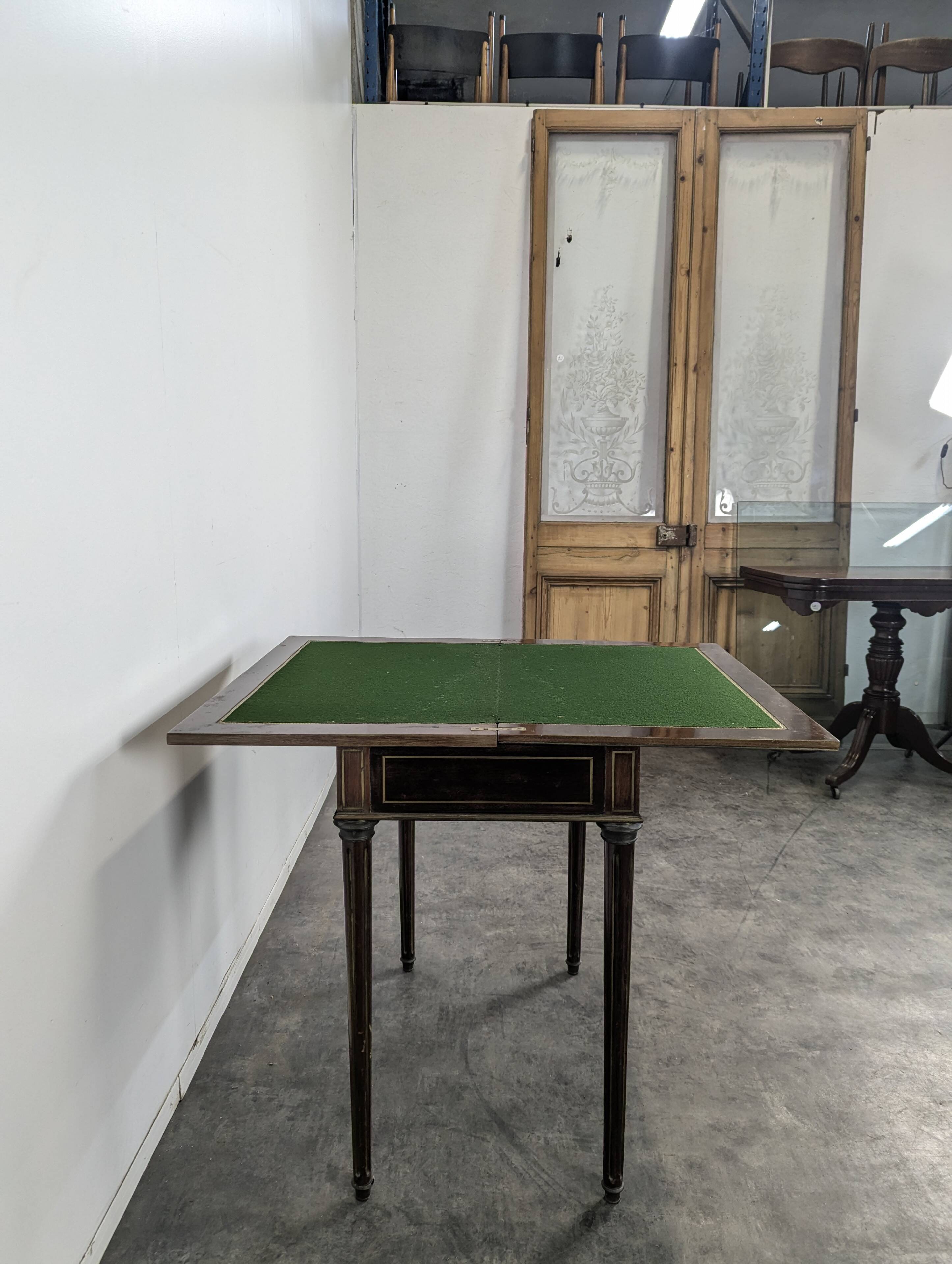 Louis XVI style mahogany game table, dressing table, and secretary.