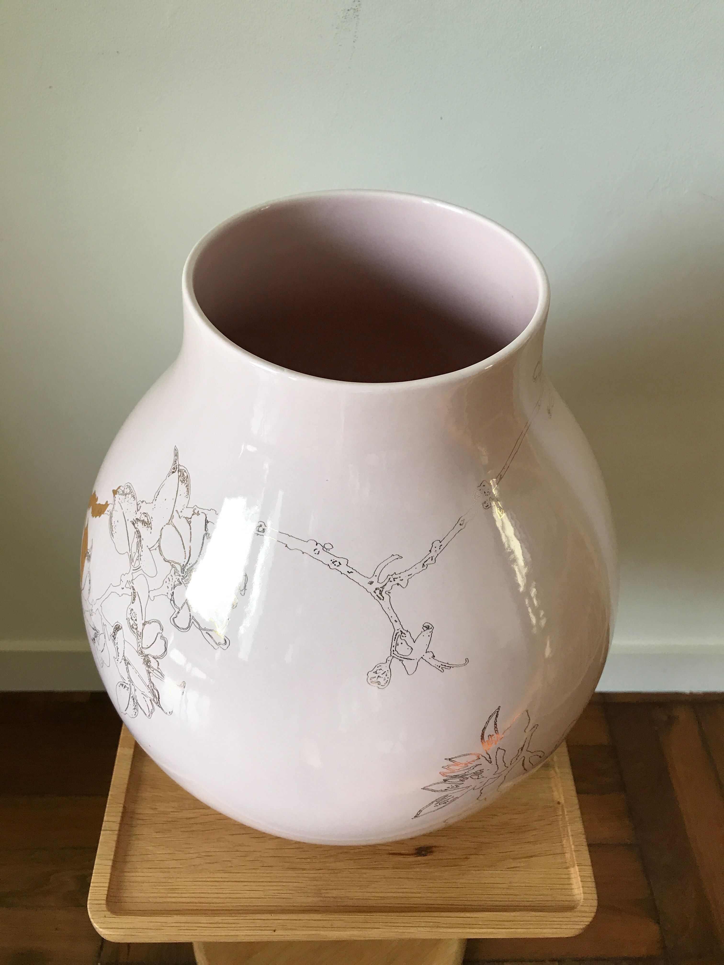 Pale pink and golden earthenware vase