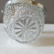 Vintage glass ice bucket stamped with a metal handle