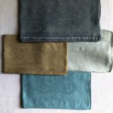 Suite of four tinted antique napkins