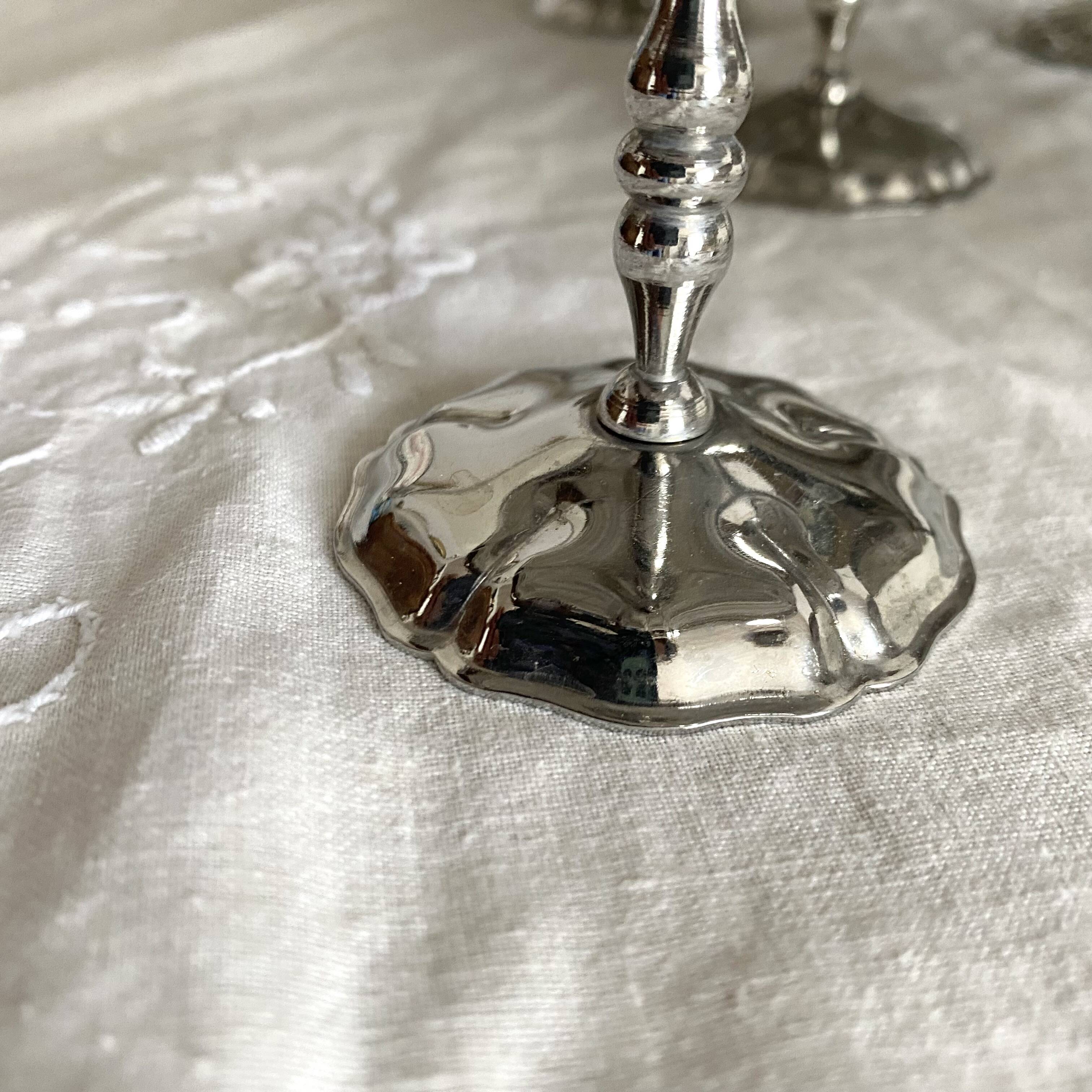 Vintage stainless steel cups on foot