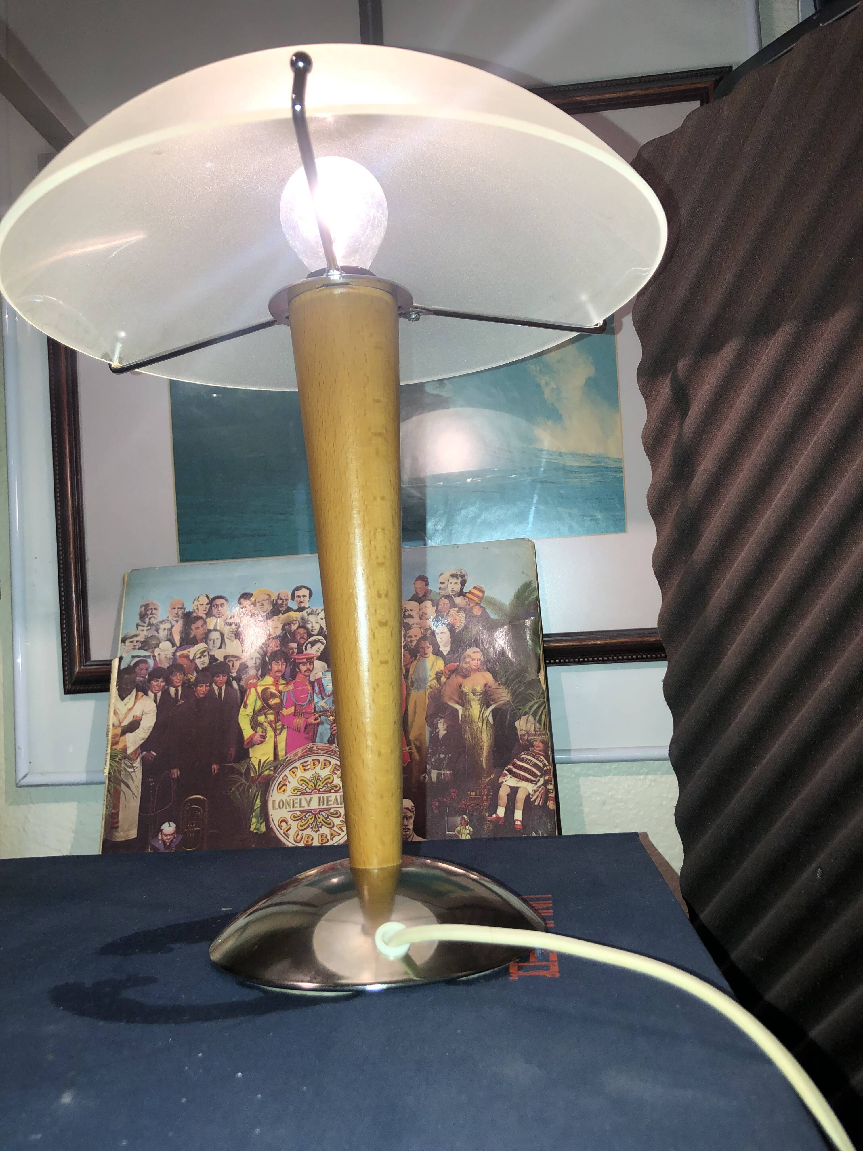 Table lamp legs chrome wood lampshade opaque glass.