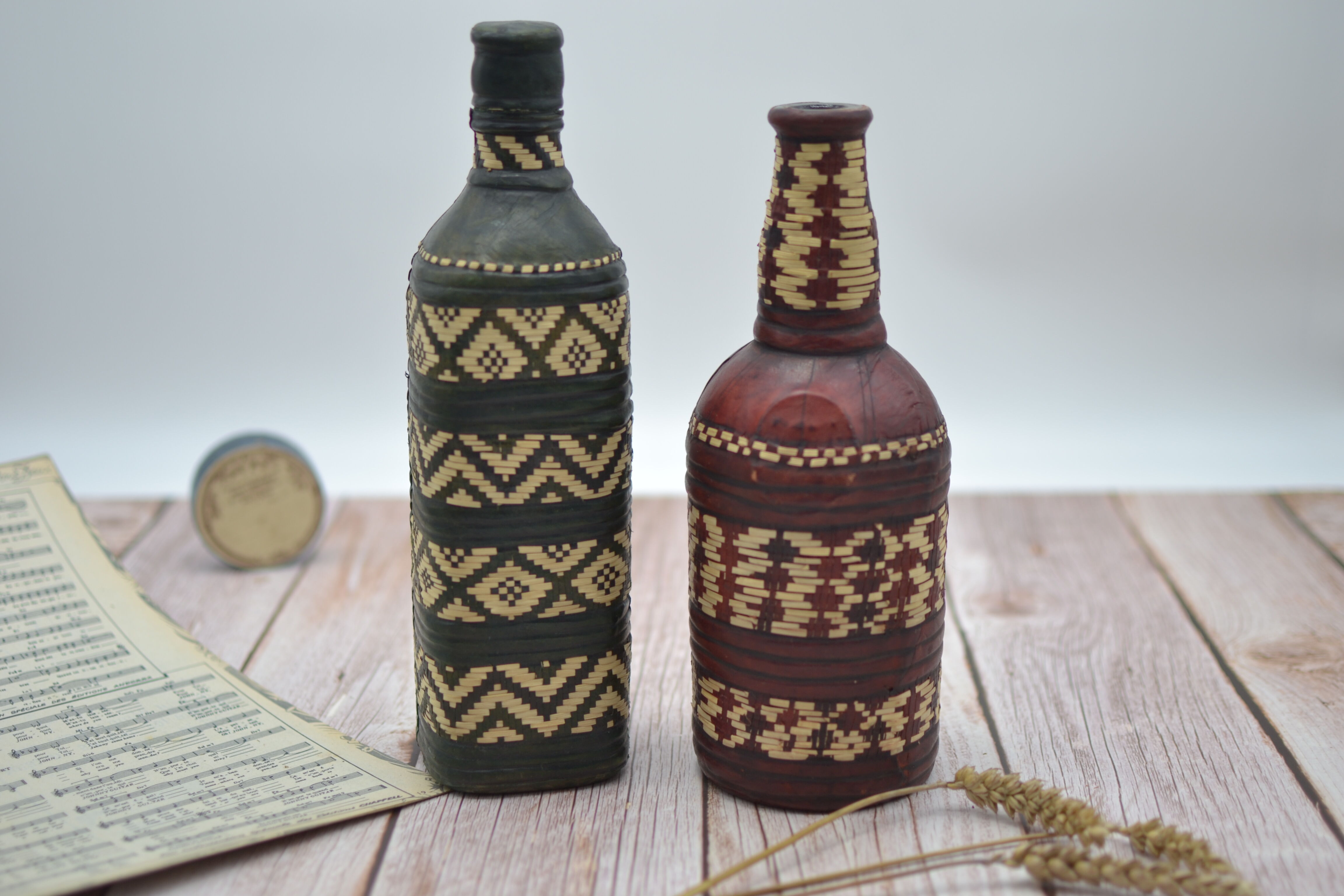 Set of 2 decorative vintage bottles covered with leather & wicker