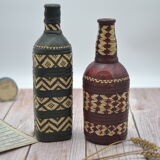 Set of 2 decorative vintage bottles covered with leather & wicker