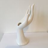 Hand soliflore wearing white ring