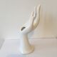 Hand soliflore wearing white ring