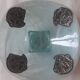 Handcrafted glass fruit bowl with ribbed design set with pewter medallions.