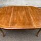 Round extendable dining table Louis XV in solid wood from the 1960s.