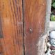 Oak entrance door and its frame and transom, wrought iron gates