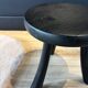 Small black wooden tripod stool
