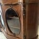 Curved mahogany display cabinet from the Napoleon III period. It has two doors and two shelves.