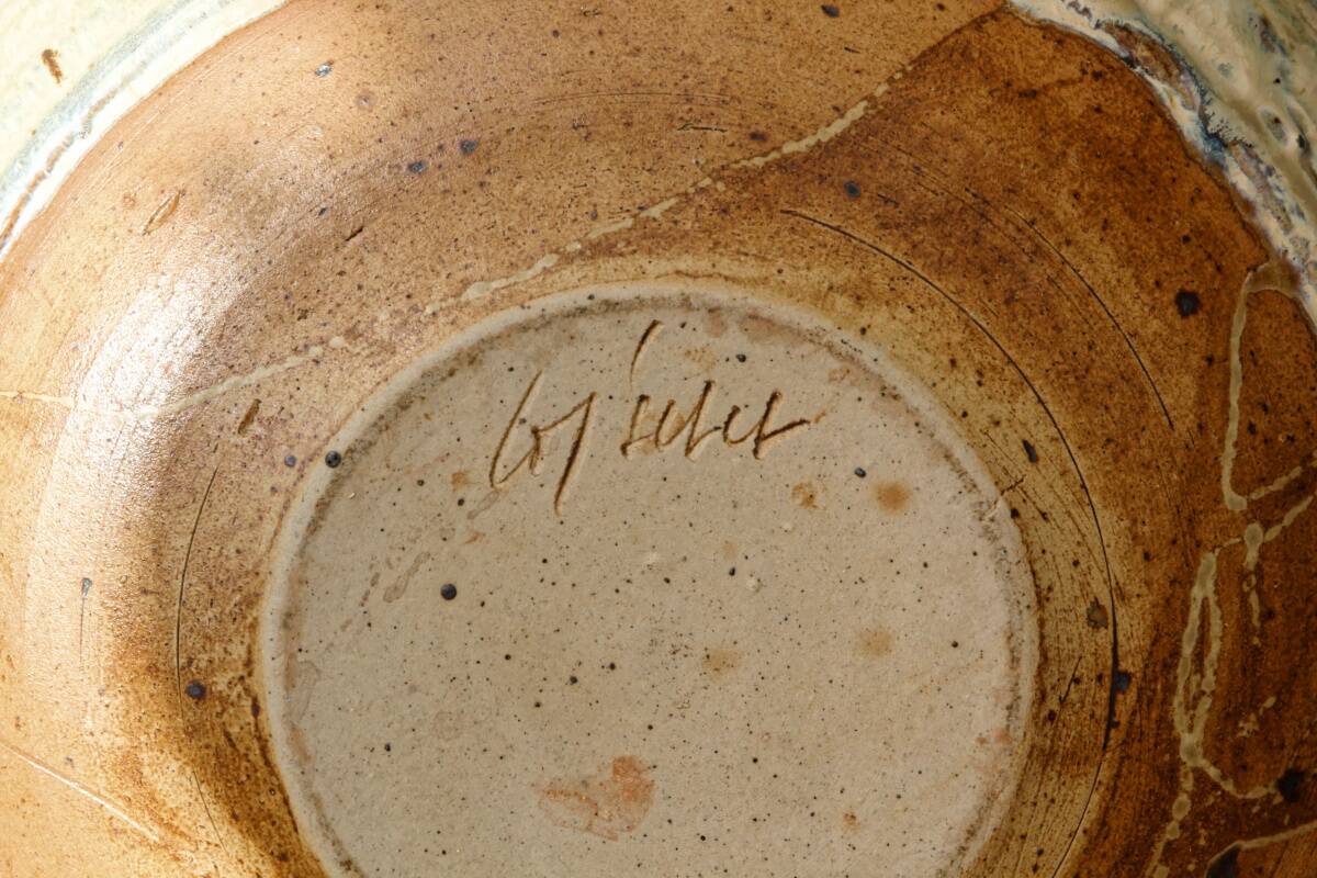 Hollow stoneware dish, signed Yves Loiselet