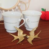 Set of 2 white porcelain cups with gold rim