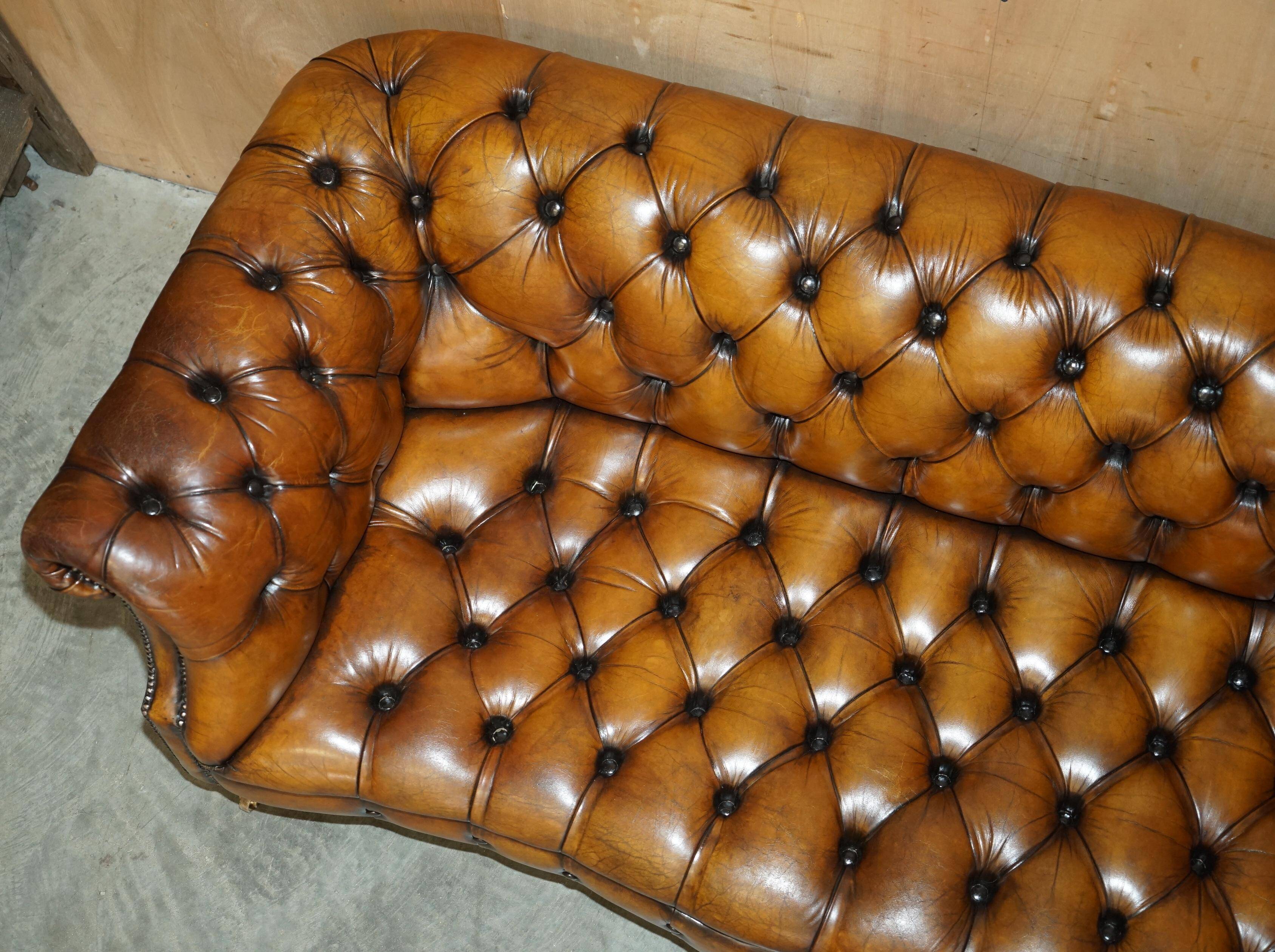 Vintage Chesterfield serpentine luxury sofa in restored leather