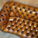 Vintage Chesterfield serpentine luxury sofa in restored leather