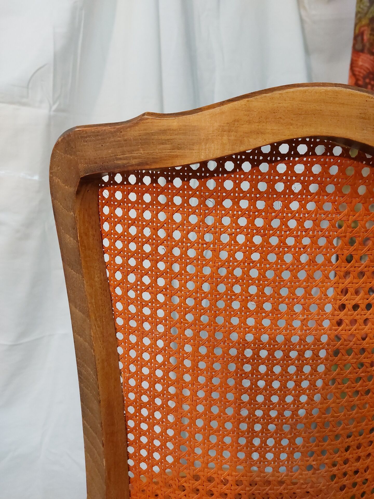Caned chair in Louis XV style painted orange.