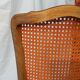 Caned chair in Louis XV style painted orange.