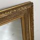 Small wooden mirror with gilded stucco in the Louis XVI style.