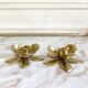 Pair of brass flower candle holders