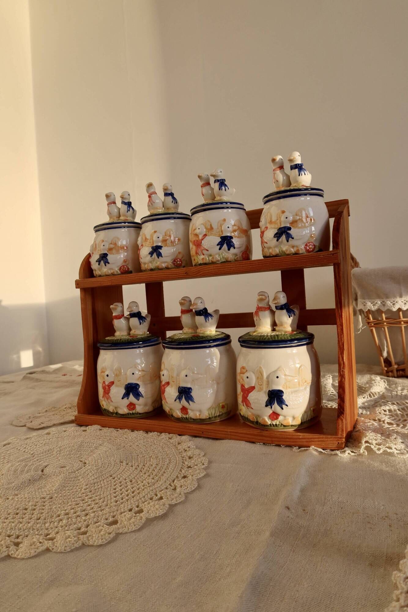 Vintage wooden wall condiment shelf and porcelain pots with geese slip pattern