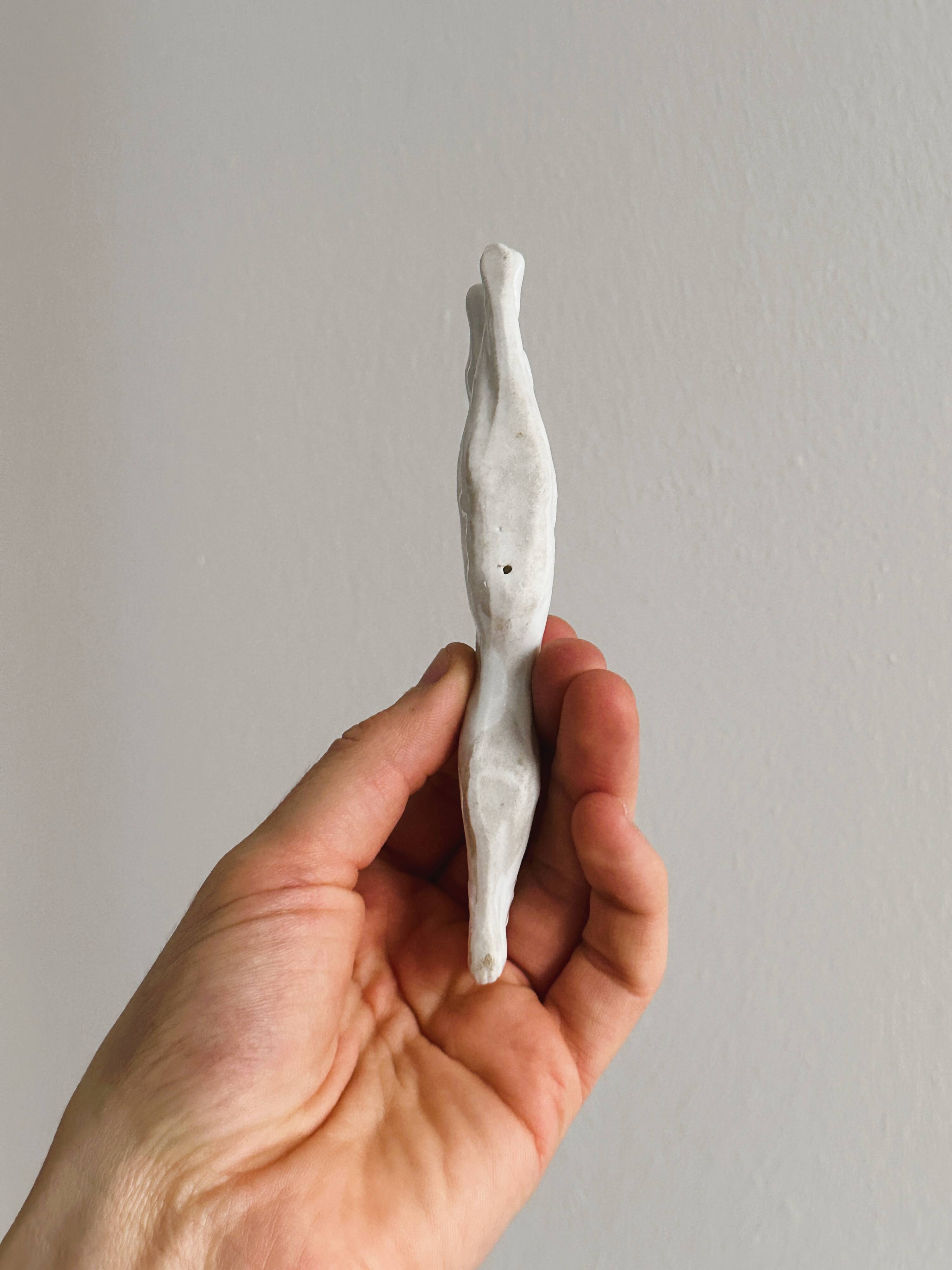 Porcelain animal knife holder.