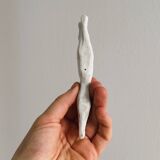 Porcelain animal knife holder.