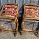 pair of rustic wood and fabric armchairs