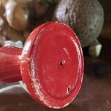Large red wooden cup-and-ball game, 9 cm in diameter.