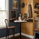 Bistro standing table with marble top and cast iron base.