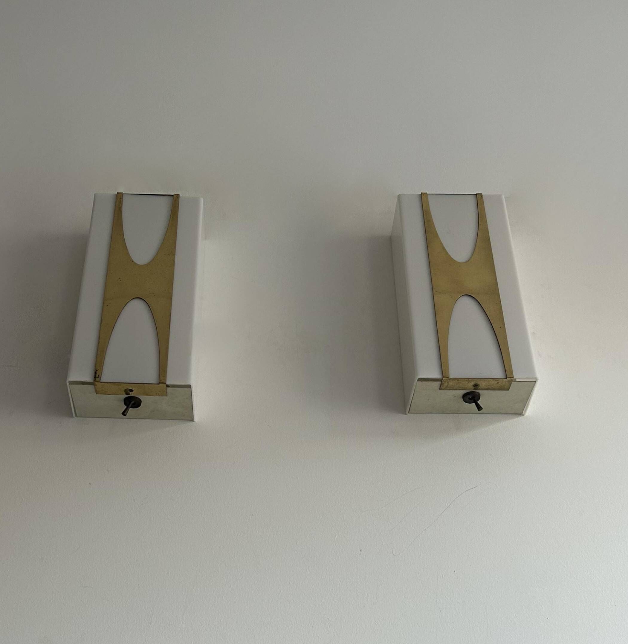 Pair of Loewy wall lights for Hilton, brass and Perspex, France 1965