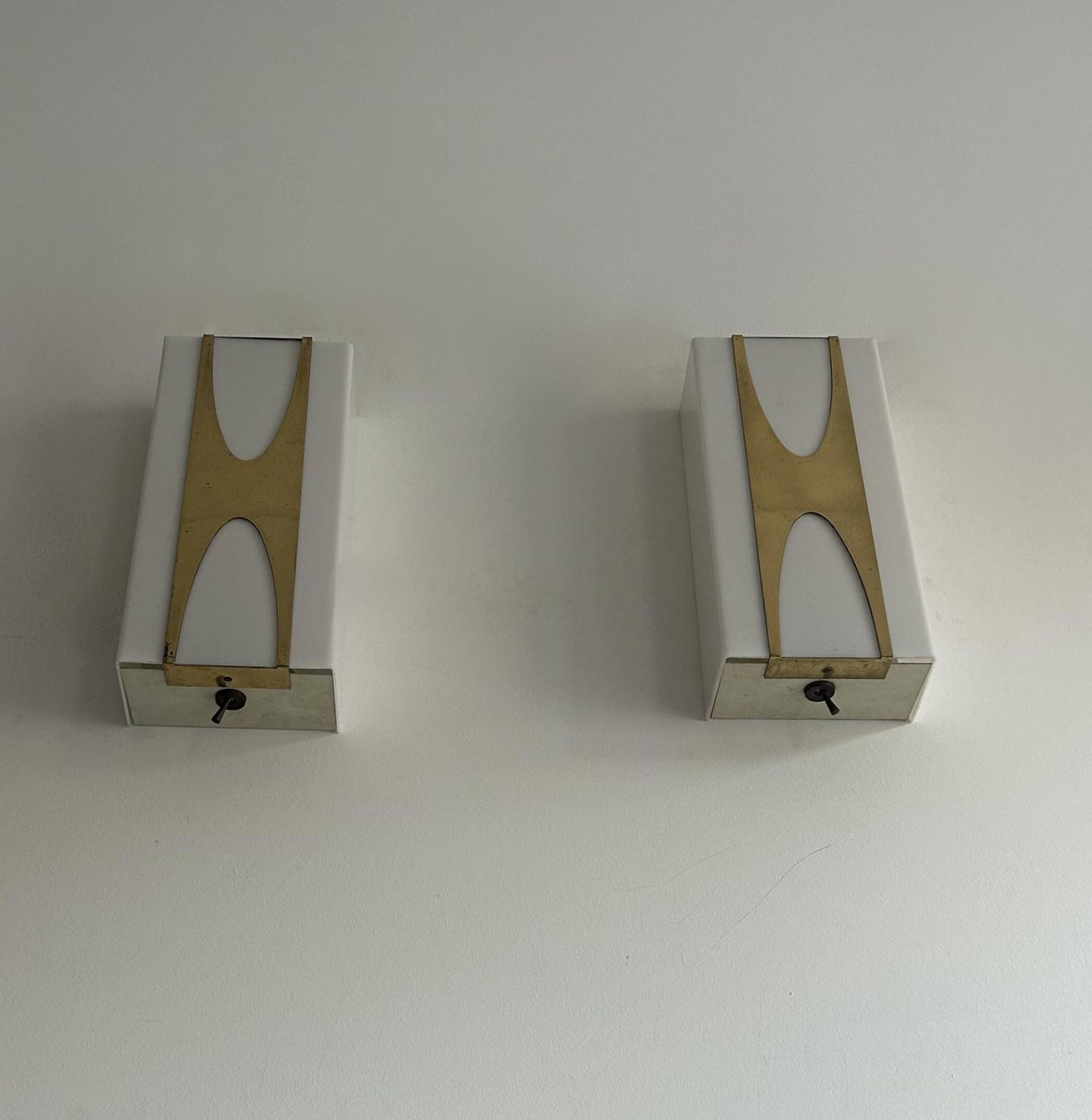 Pair of Loewy wall lights for Hilton, brass and Perspex, France 1965