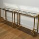 Pair of brass and antique mirror side tables from the Baguès house.