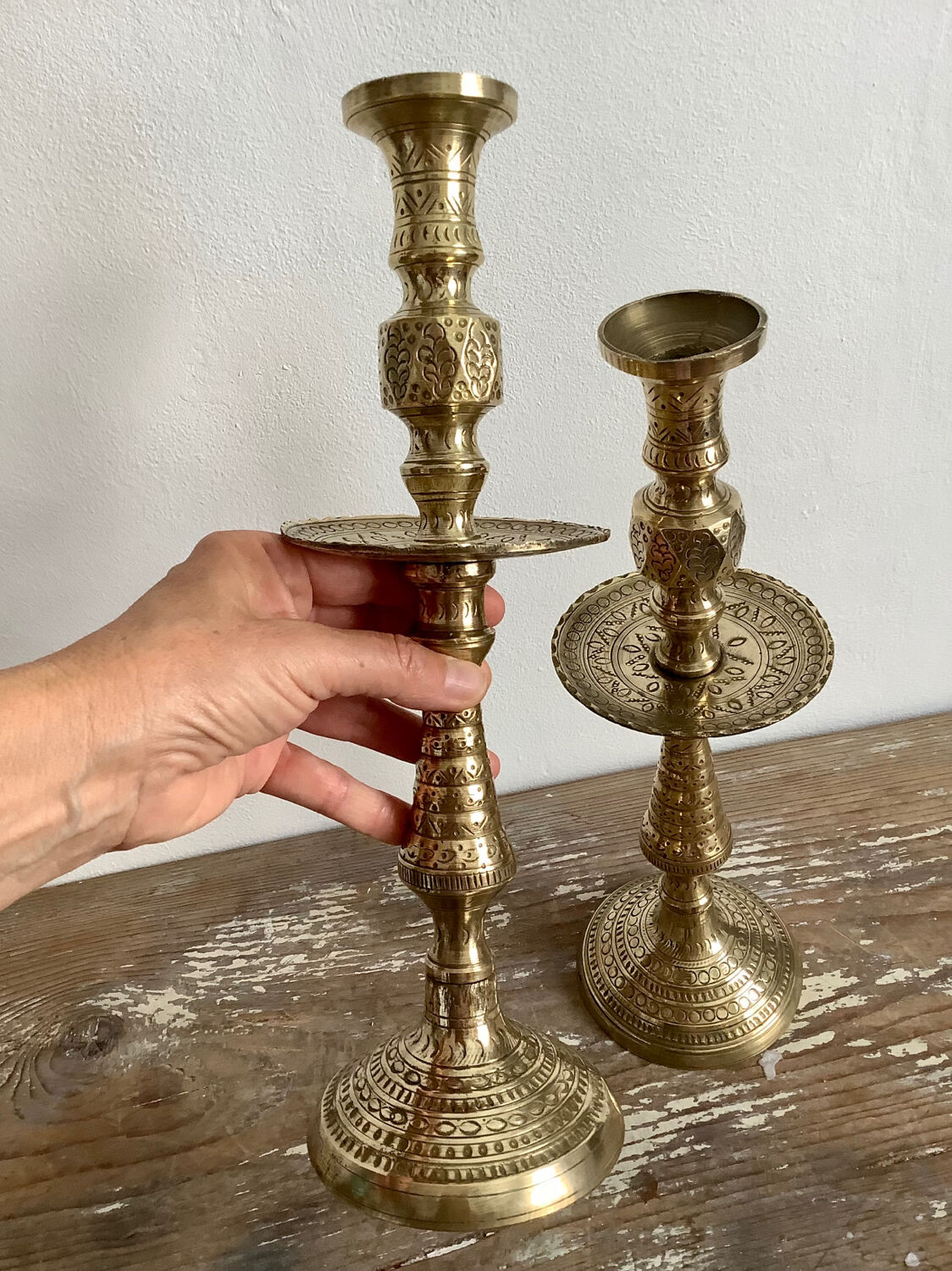 Pair of engraved brass candle holders
