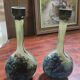 Pair of flower vases in glass paste, with a long slender neck.