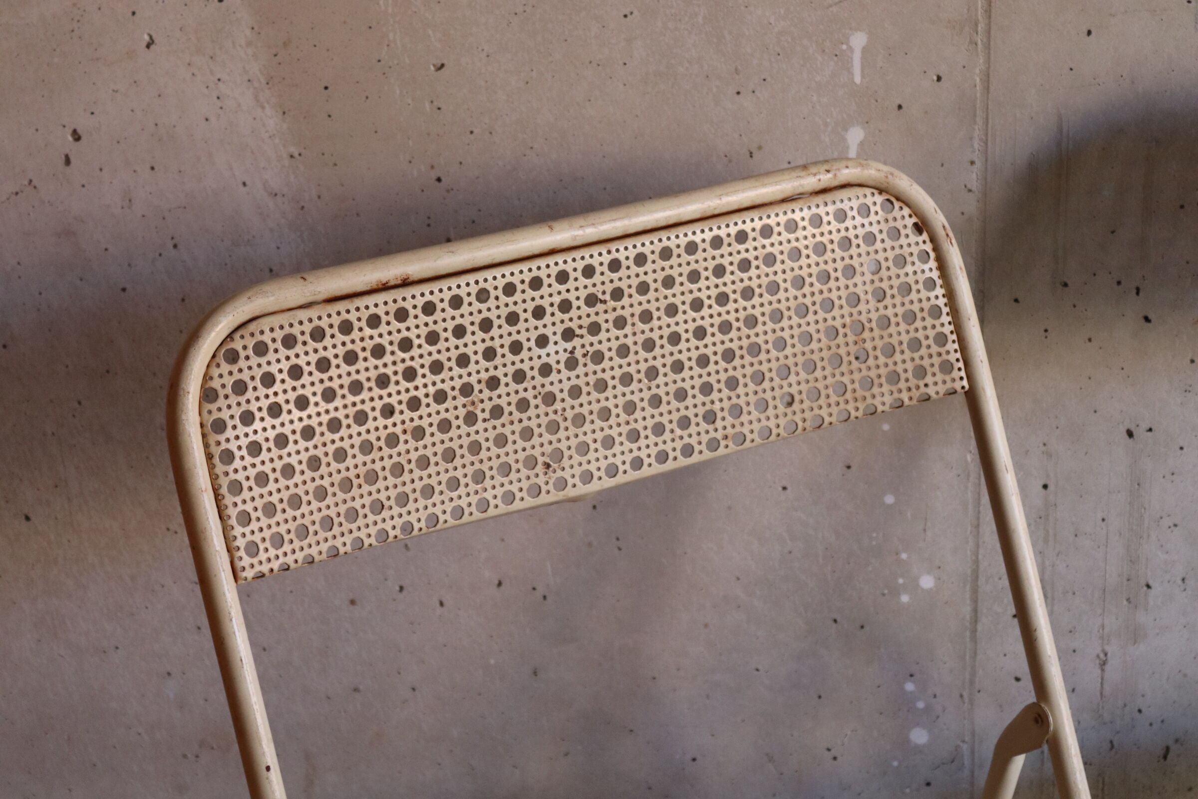 Two metal tanned folding chairs
