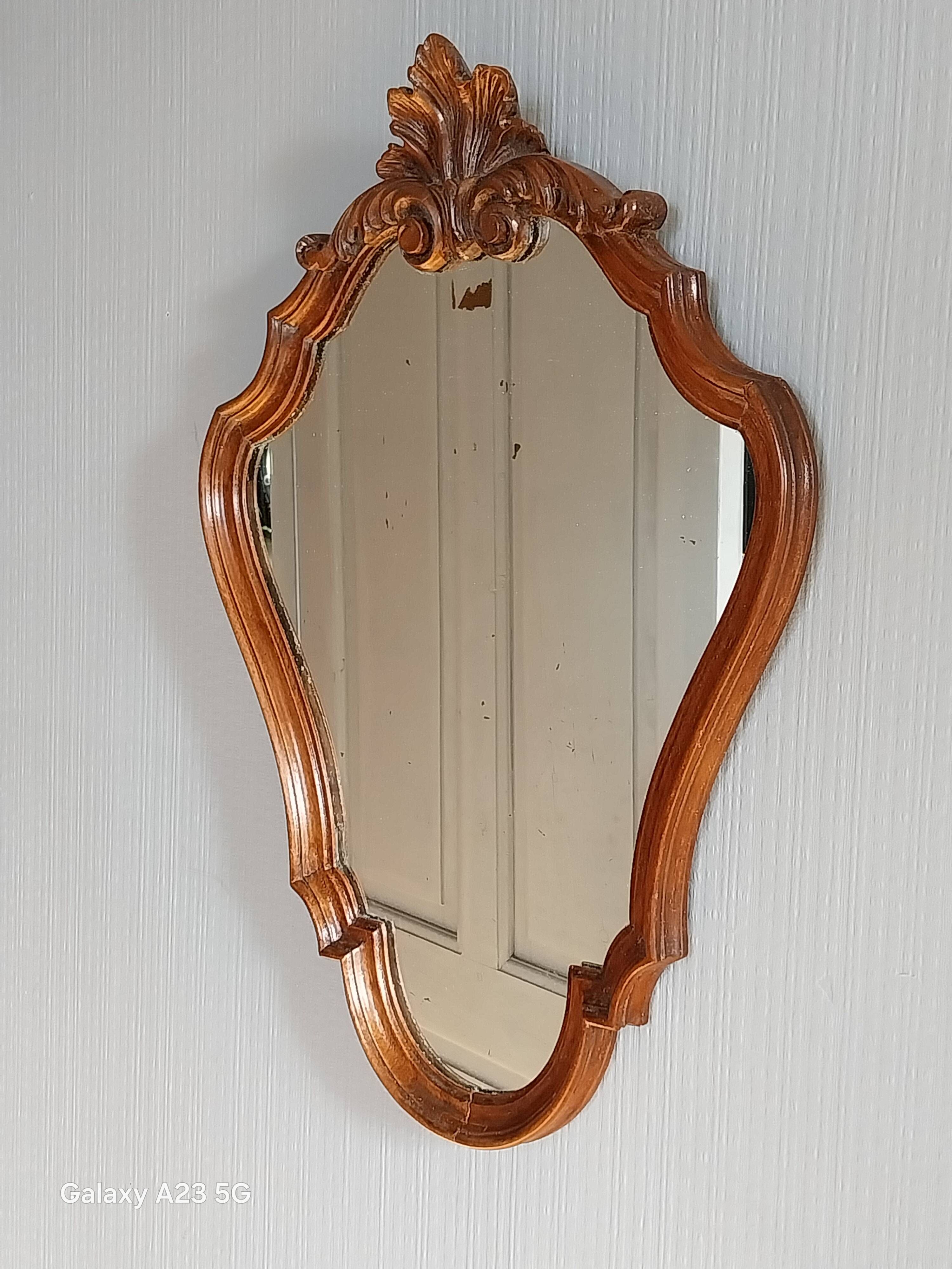 Louis XV style mirror, carved in polished solid wood. Shell pediment.
