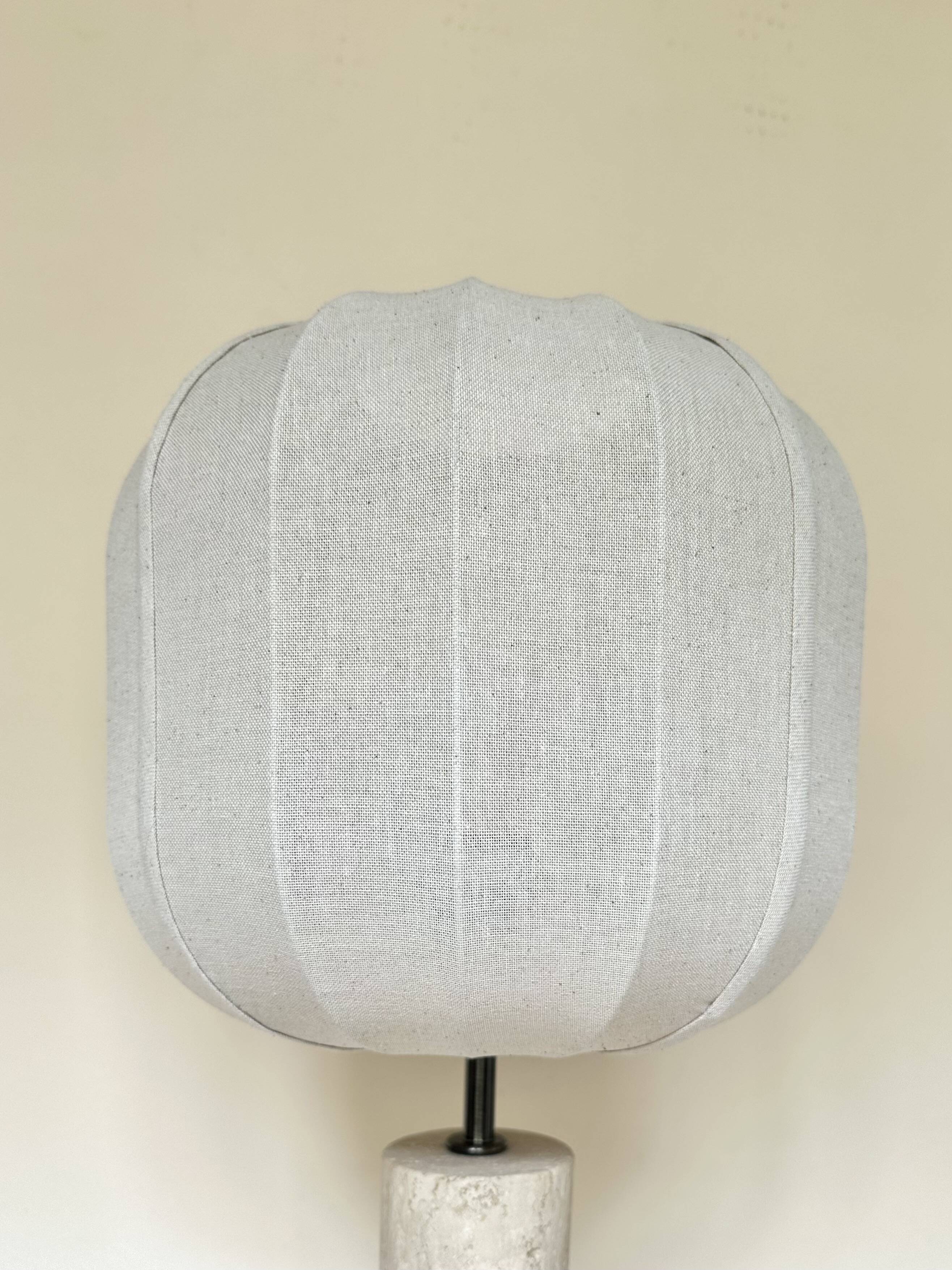 Travertine lamp with round linen shade