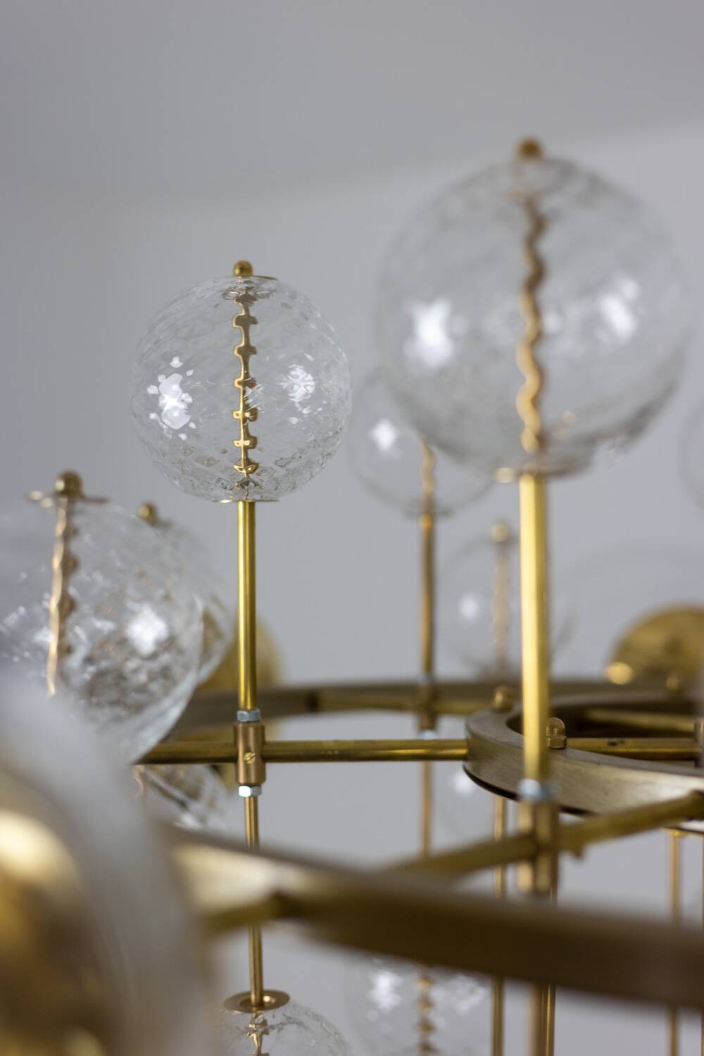 Large chandelier in gilded brass with decorative balls. 1970s.