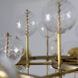 Large chandelier in gilded brass with decorative balls. 1970s.