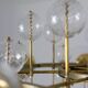 Large chandelier in gilded brass with decorative balls. 1970s.
